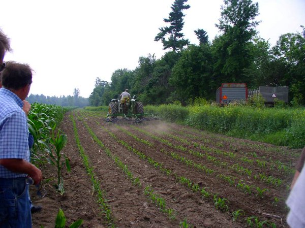 Farmer demonstrating field cultivation.